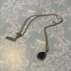 Kendra Scott Gold and Black Necklace with Elegant Design